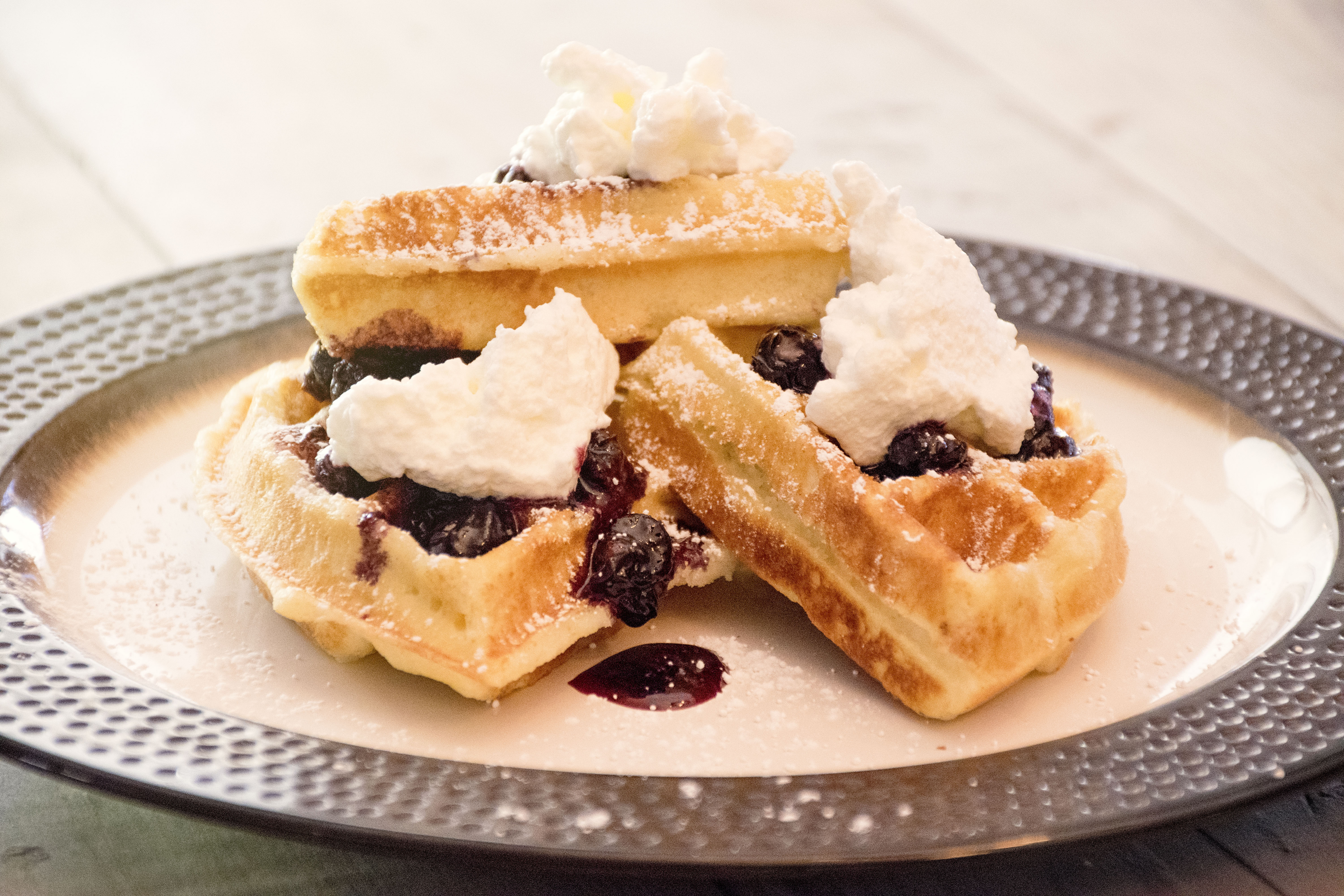 gluten free waffles with blueberry syrup sauce and cream